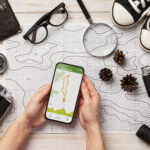 Best travel apps displayed on smartphone travel planning screen