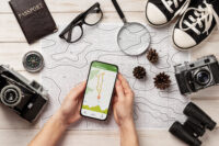 Best travel apps displayed on smartphone travel planning screen