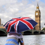UK immigration post-Brexit debate flares up as St. George flags fly across British neighborhoods amid rising support for the populist right.